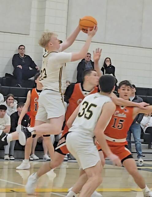 Penn-Trafford's Ethan McDonald goes up for the game-winning shot Wednesday in a 45-43 victory over Latrobe. (Bill Beckner Jr. | TribLive)