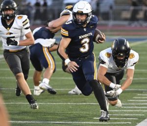 Norwin quarterback Tristan Tavares up the sideline for a first down against North Allegheny on Sept. 19, 2025 at Norwin. (Chaz Palla | TribLive)