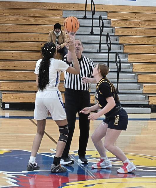 Jeannette's Jayden Goodson (left) and Mikaila Ditty of Apollo-Ridge jump center on Thursday night at Jeannette. (Bill Beckner Jr. | TribLive)