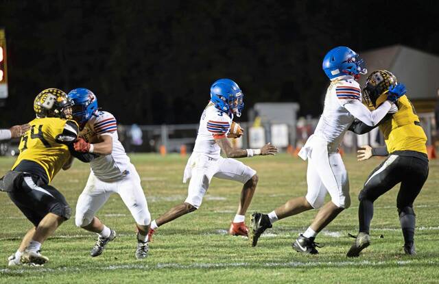 Jeannettes Kymone Brown looks for a seam in the Bentworth defense during Fridays WPIAL Class A first-round playoff game. (Floyd Kish | Mon Valley Independent)