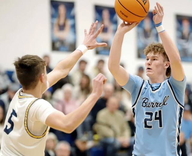 Burrell's Ryan Wass attempts a 3-pointer over Freeport's Gavin Tola on Friday, Jan. 30, 2026. Wass finished with a game-high 19 points. (Josh Rizzo | For TribLive)