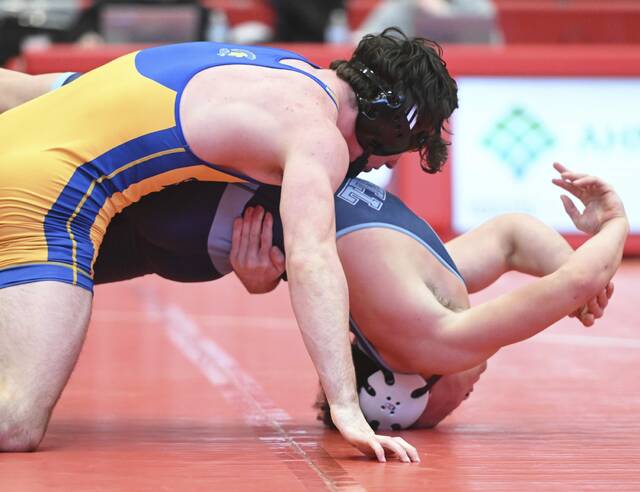Derrys Ewan Olson beats Burrells Antonio Perkins in the 160-pound bout during the WPIAL Class 2A team wrestling championship Saturday at Peters Township. (Chaz Palla | TribLive)