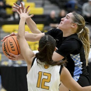 Seneca Valleys Brooke Dufford drives past North Alleghenys Vange Balouris s on Dec. 17, 2025. (Christopher Horner | TribLive)