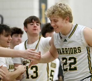 Penn-Trafford’s Jacob Briggs celebrates with teammates after hitting back-to-back 3-pointers against Thomas Jefferson on Wednesday, Jan. 21, 2026, in Harrison City. (Christopher Horner | TribLive)