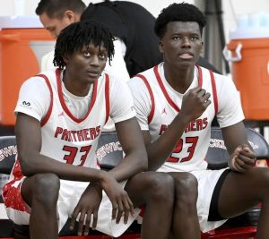 Sewickley Academy’s Mamadou Kane (right) talks with Adam Ikamba on the bench during halftime against Obama Academy on Wednesday, Jan. 28, 2026, in Sewickley. (Christopher Horner | TribLive)