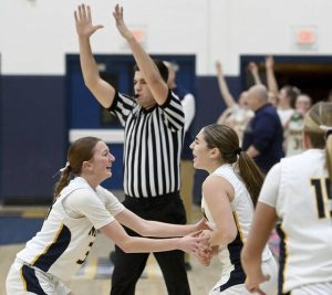 Norwin’s Giuliana Giannikas celebrates her 3-pointer at the first quarter buzzer with Jacalynn DeMarines during their game against Upper St. Clair on Tuesday, Jan. 27, 2026, at Norwin. (Christopher Horner | TribLive)