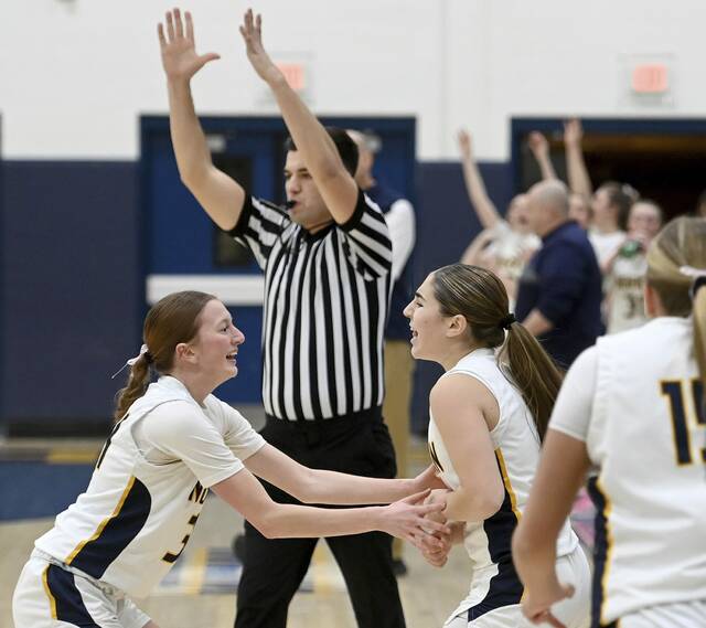 Norwin’s Giuliana Giannikas celebrates her 3-pointer at the first quarter buzzer with Jacalynn DeMarines during their game against Upper St. Clair on Tuesday, Jan. 27, 2026, at Norwin. (Christopher Horner | TribLive)