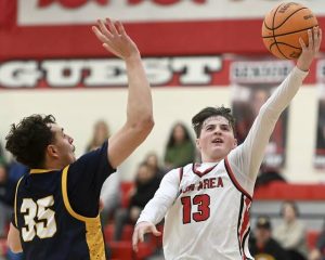 Moon’s Brody Bauman scores past Mars’ Ben Detisch during their game on Friday, Jan. 30, 2026, at Moon. (Christopher Horner | TribLive)