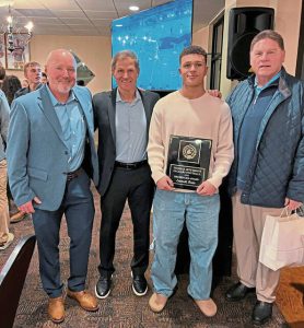 Thomas Jefferson senior Emmett Forte poses with, from left, Jim Breisinger, Scott Breisinger and coach Bill Cherpak at the TJ football banquet Jan. 18. Forte is the winner of this years Breisinger Award at TJ. (Courtesy of Steve Colditz)