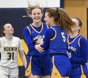 Canon-McMillan’s Faye Saunders celebrates with Madison Clair as time expires against Norwin on Monday, Feb. 2, 2026, at Norwin. (Christopher Horner | TribLive)