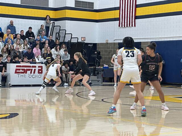 Greensburg Central Catholic's Erica Gribble defends as Shady Side Academy's Jocelyn Long tries to drive during their game Monday. (Bob Orkwis | For TribLive)