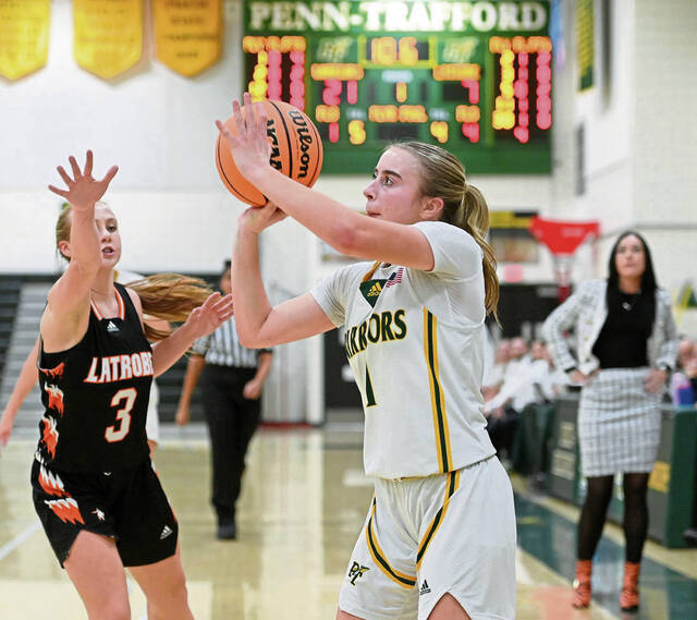 Penn-Traffords Isabella Fontana shoots a 3-pointer as Latrobes Brianna Havrilla defends Dec. 16, 2025, at Penn-Trafford. (Christopher Horner | TribLive)