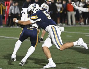 Norwins Josh Lenart sacks Mt. Lebanon quarterback Patrick Smith on Oct. 24, 2025. (Chaz Palla | TribLive)