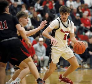 Mohawks Bobby Fadden looks for a path to the rim against the Southmoreland defense during a playoff game last year. (Josh Rizzo | TribLive)
