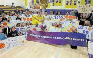 Plum players and fans celebrate Riley Stephans reaching 1,000 points after a home win over Penn-Trafford on <ins>Wednesday, </ins> Jan. 28<ins>,</ins> <ins>2026</ins> . (Michael Love | TribLive)