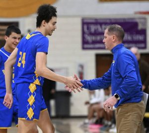 Derry head coach Tom Esposito congratulates Stanley Rajkovich after he scored his 1,000th career point on Jan. 20, 2026, at Greensburg Salem. (Christopher Horner | TribLive)