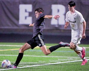 Quaker Valleys Liam Miller takes a shot next to Hopewells Tallon Coleman on Oct. 7, 2025, in Leetsdale. (Christopher Horner | TribLive)