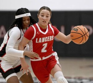 Neshannock’s Sophia Bonner drives past Aliquippa’s Jakhia Arnold during their game on Wednesday, Feb. 4, 2026, at Aliquippa. (Christopher Horner | TribLive)