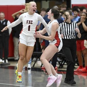 Fox Chapels Lyla Jablon (left) celebrates with Bailey Sacco after defeating Penn Hills, 45-44, on Dec. 12, 2025, at Fox Chapel. (Christopher Horner | TribLive)