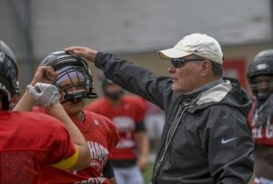 Fox Chapel football coach Tom Loughran works with his varsity team during practice Aug. 17, 2021. (Louis B. Ruediger | TribLive)