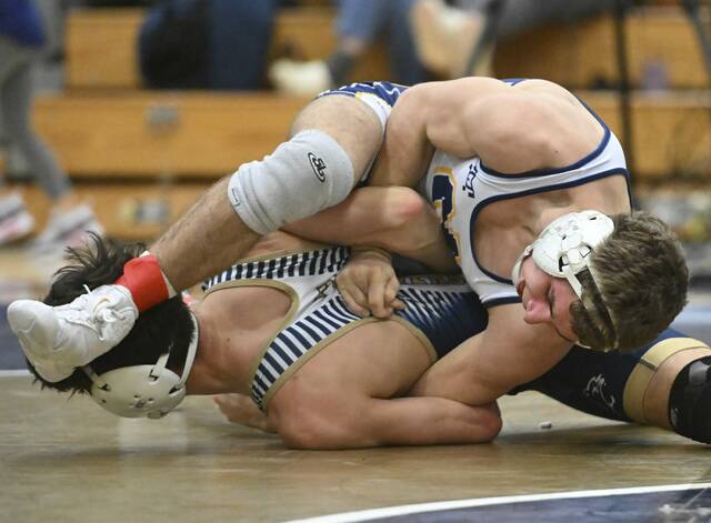 Norwins Dom Butera tries to turn Franklin Regionals Sal Nassif at 133 pounds Jan. 20 at Franklin Regional. (Chaz Palla | TribLive)