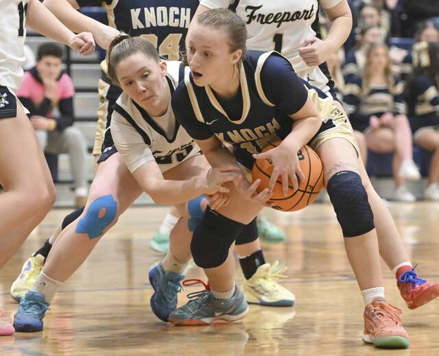 Freeports Jaisa Gaillot fights for a loose ball with Knochs Liv Foster on Thursday at Freeport Area Middle School (Chaz Palla | TribLive)