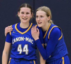 Canon-McMillans Faye Saunders hugs Brooke Stanton in the final seconds against Norwin on Monday. (Christopher Horner | TribLive)