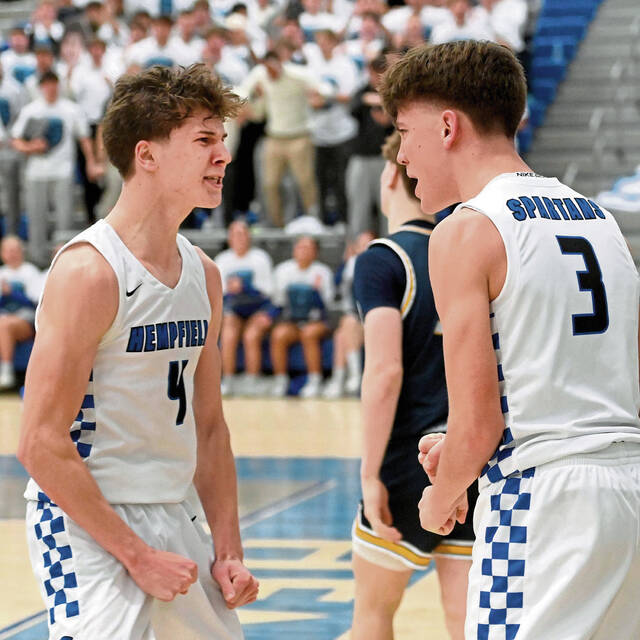 Hempfield’s Daniel Husenits celebrates with Lucas Simmons after he scored late in their game against Norwin on Friday, Feb. 6, 2026, at Hempfield. (Christopher Horner | TribLive)