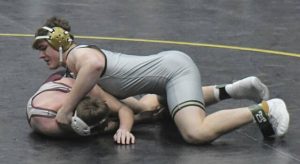 Franklin Regional sophomore John Montgomery works for a pin in the PIAA Class 3A quarterfinals Friday. (Paul Schofield | TribLive)