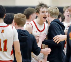 North Catholic's Jude Rottmann celebrates with his teammates after North Catholic beat Deer Lakes, 81-77, on Friday night at home. (Josh Rizzo | For TribLive)