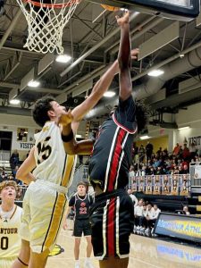 Moons AJ Buford drives against Montours Sal Magliocco on Friday. (Antonio Rossetti | For TribLive)