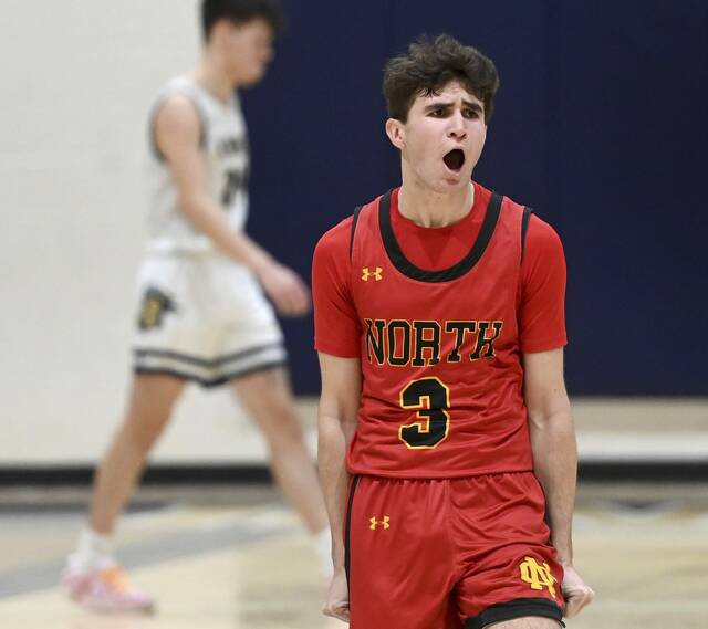 North Catholics Brady Trout celebrates after Knoch called a timeout on Feb. 3 in Saxonburg. (Christopher Horner | TribLive)