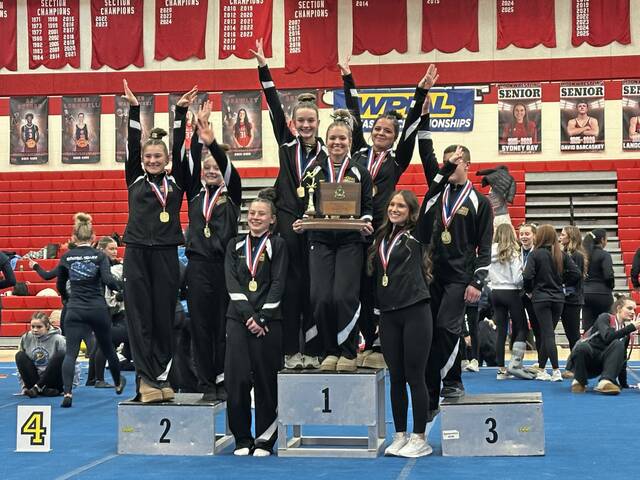 The Thomas Jefferson gymnasts celebrate their fourth WPIAL team title in eight years Saturday. (Brennan Valladares | For TribLive)