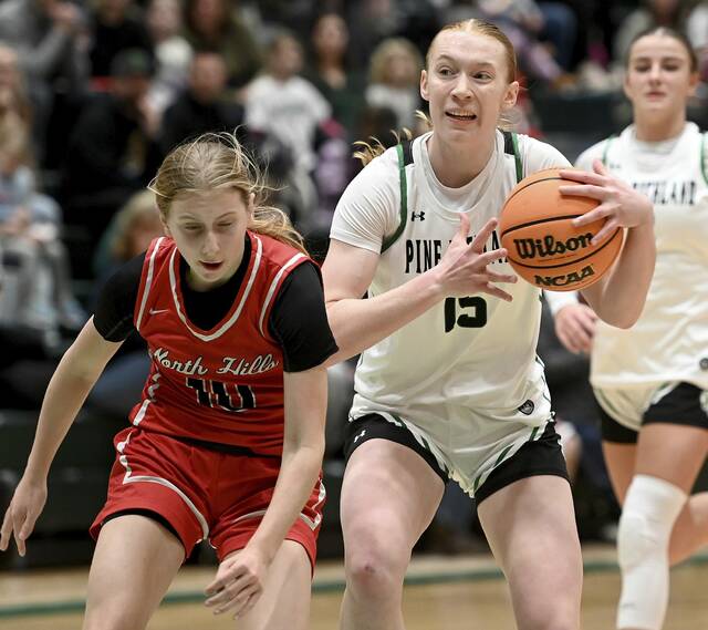 Pine-Richlands Rebekah Shaffer drives past North Hills Zoe Devlin on Jan. 29. (Christopher Horner | TribLive)