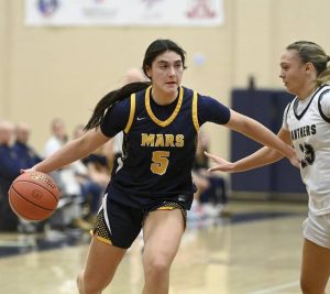 Mars Alexis Cashdollar drives past Franklin Regionals KC Yaniga during their game on Monday, Dec. 1, 2025, in Murrysville. (Christopher Horner | TribLive)