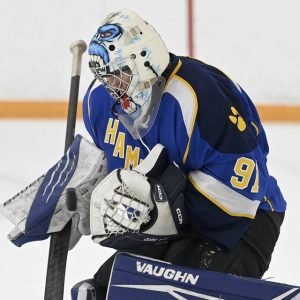 Hampton goalie Konstantone Sarris makes a save against Blackhawk on Thursday, Nov. 20, 2025, at the Bradys Run Park ice arena. (Christopher Horner | TribLive)