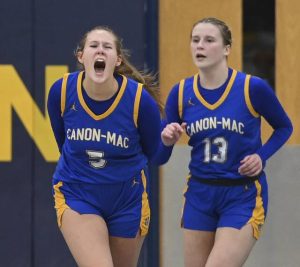 Canon-McMillan’s Madison Clair celebrates next to Lauren Borella after a Norwin timeout on Monday, Feb. 2, 2026, at Norwin. (Christopher Horner | TribLive)