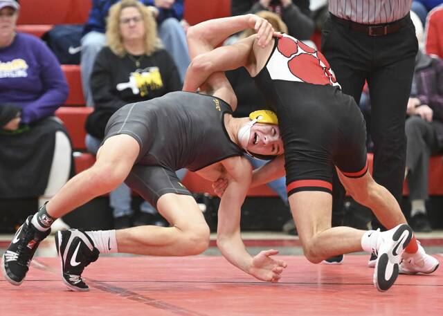 Moons Cael Yanek beats North Alleghenys Gus Stedeford in the 133-pound bout during the Allegheny County wrestling championships last month. (Chaz Palla | TribLive)