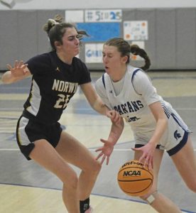 Hempfield senior Gabby Coccia drives to the hoop against Norwins Elizabeth Yarosik on Feb. 5. (Paul Schofield | TribLive)