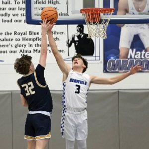 Hempfields Lucas Simmons pressures Norwins King Carver after a steal in the final second of overtime Feb. 6. (Christopher Horner | TribLive)