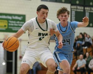 Belle Vernons Luca Ghilani (left) drives past Burrells Ryan Wass during their WPIAL Class 4A first-round game Friday. (Mike Darnay | Mon Valley Independent)