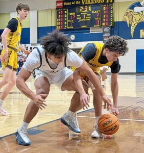 Hopewell's James "Booboo" Armstrong and Greensburg Salem's Solomon Cain vie for a loose ball in a WPIAL Class 4A first-round game Friday, Feb. 13, 2026. (Antonio Rossetti | For TribLive)