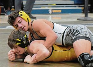 Penn-Trafford senior Dylan Barrett takes down Thomas Jefferson junior Zach Rehak in the 114-pound final at the WPIAL Class 3A Eastern Section tournament Saturday. (Paul Schofield | TribLive)