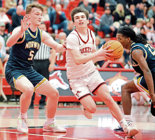 Fox Chapels Joe McGivney drives past Norwins Alex Graney during the first half Monday. McGivney finished with a game-high 20 points. (Josh Rizzo | For TribLive)