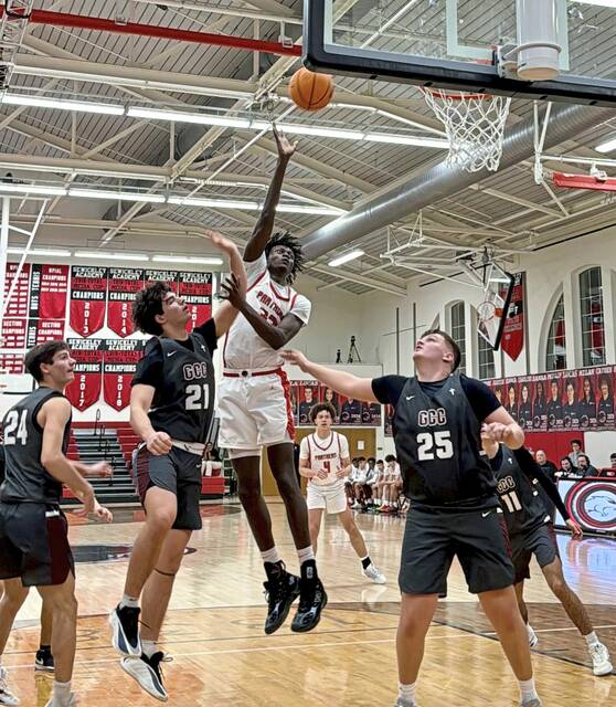 Sewickley Academys Adam Ikamba scores against Greensburg Central Catholic in the Class 2A first round Monday, Feb. 16, 2026. (Antonio Rossetti | For TribLive)
