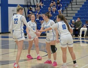 South Parks (from left) Bella Stromberg, Gianna Cardillo, Hayley Bennett and Andrea Kuczma huddle up during a WPIAL Class 4A first-round victory over Freeport on Monday. (Brennan Valladares | For TribLive)
