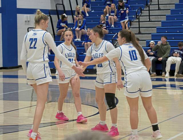 South Parks (from left) Bella Stromberg, Gianna Cardillo, Hayley Bennett and Andrea Kuczma huddle up during a WPIAL Class 4A first-round victory over Freeport on Monday. (Brennan Valladares | For TribLive)