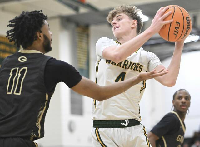 Penn Traffords Nick Ponko grabs a rebound over Gateways Isaiah Allah on Feb. 3. (Chaz Palla | TribLive)