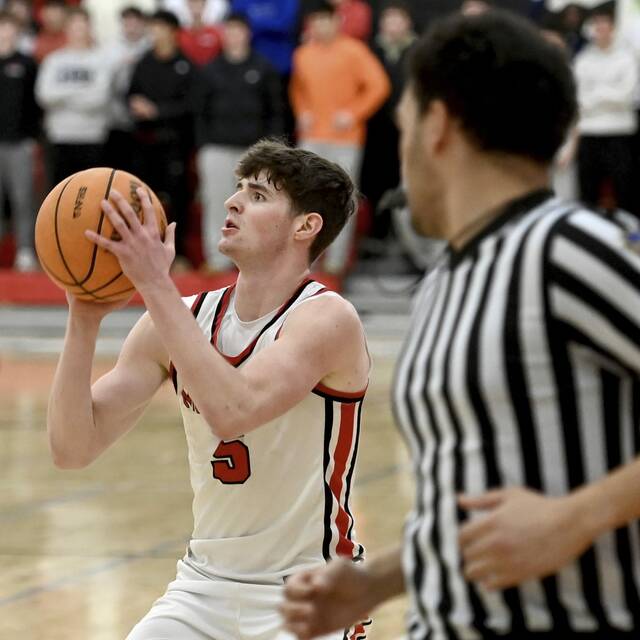 Moons Jackson Bauman pulls up for a 3-pointer against Mars on Jan. 30. (Christopher Horner | TribLive)