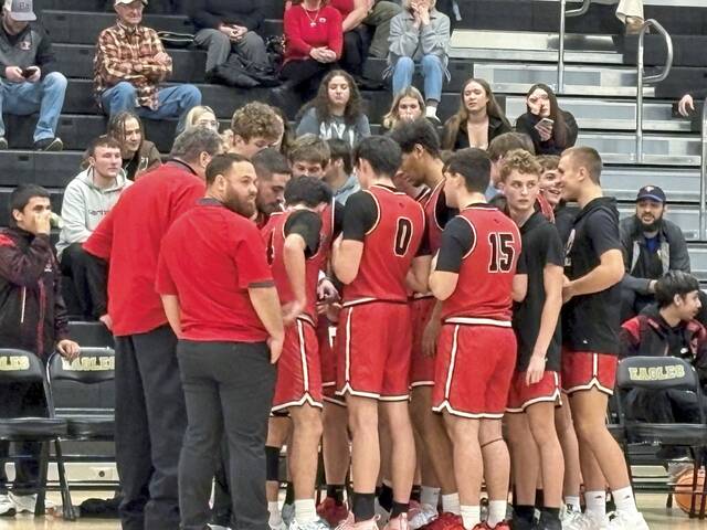 Ligonier Valley players huddle up during an upset win over Keystone Oaks in the WPIAL Class 3A first round Tuesday. (Don Rebel | TribLive)